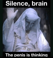 a statue of a man with the words silence brain the penis is thinking below it