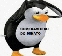 a stuffed penguin with the words comeram o cu do minato on it 's face .