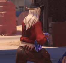 a woman with long white hair and a cowboy hat