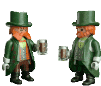 two toy leprechauns are holding mugs of beer in their hands