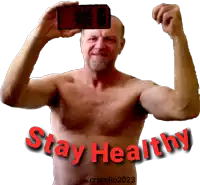 a shirtless man takes a picture of himself with the words stay healthy in red letters