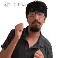 a man with glasses and a beard holds his fist up with the words 40 bpm above him