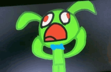 a green cartoon character with red eyes and a blue bow tie is on a computer screen .