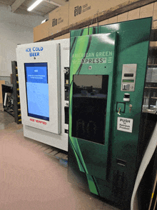 a green and white american express vending machine