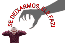 a man with his hands on his head stands in front of a shadow of a hand that says se deixarmos ele faz