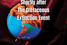 a blue globe with fried chicken in it and the words shortly after the cretaceous extinction event