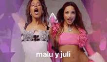 two women in pink dresses are standing next to each other on a purple background .