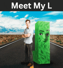 a man standing next to a green block that says meet my l on it