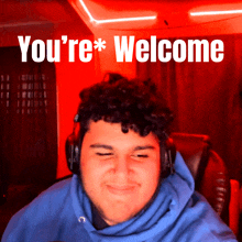 a man wearing headphones is smiling in front of a red background that says " you 're welcome "