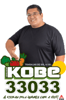 a man stands in front of a sign that says kobe 33003