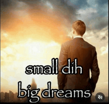 a man in a suit stands in front of a cloudy sky with the words small dil big dreams above him