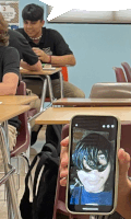 a person holding a cell phone with a picture of a girl on the screen