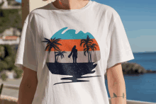 a woman is wearing a white t-shirt with a picture of a surfer on it