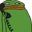 a green frog is talking on a telephone with an orange scarf around its neck .