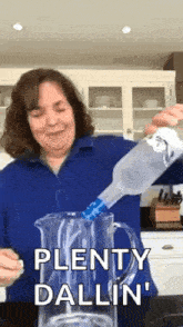 a woman is pouring a bottle of vodka into a pitcher with the words plenty dallin ' on it .