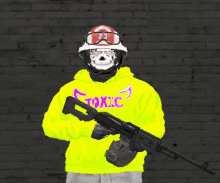 a man wearing a yellow toxic hoodie is holding a rifle