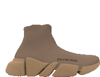 a pair of tan balenciaga shoes with a brown sole