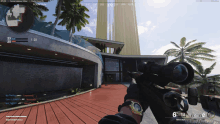 a person holding a sniper rifle in front of a building with the words fountain on the screen