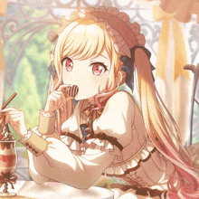 a girl with long blonde hair is eating a chocolate