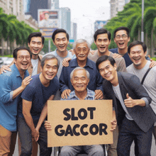 a man in a wheelchair holds a sign that reads slot gaccor