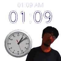 a man stands in front of a clock that says 1:09 am on it