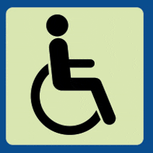 a person in a wheelchair is shown on a blue and yellow sign