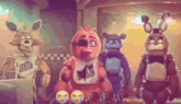 a group of five nights at freddy 's characters are standing next to each other .
