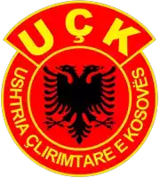 a red circle with a black eagle and the words uck