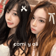 two girls with bows in their hair and the name cami y ali