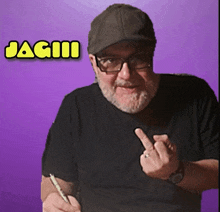 a man wearing glasses and a hat is giving the middle finger and the name jagii is above him