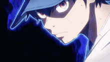 a close up of a boy 's face with a blue background