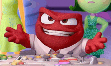 a red cartoon character from inside out is sitting at a desk with his arms outstretched .