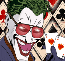 a cartoon of the joker holding a pair of playing cards with the letter r on them