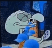 a squidward from spongebob squarepants is crying while holding a blue flower in his mouth .