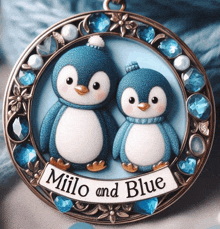 a milo and blue christmas ornament with two penguins on it