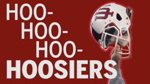 a person holding a football helmet with the words hoo hoo hoo hoosier written on it