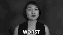 a woman in a black and white photo is making a face and says worst .