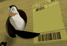 a penguin is sticking its head out of a hole in a piece of paper with a barcode on it