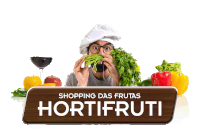 a man in a chef 's hat is eating vegetables in front of a sign that says shopping das frutas hortifrutti