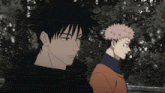 two anime characters are standing next to each other and one has a n on his head