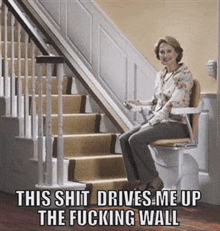 a woman is sitting on a chair on a set of stairs with the caption this shit drives me up the fucking wall