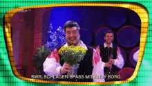 a man holding a bouquet of flowers with the words swr schlager-spass mit andy borg