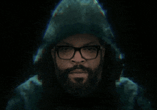 a man with a beard wearing glasses and a hood says " join the rebellion "