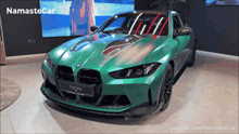 a green bmw is displayed on a youtube channel