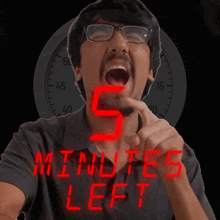 a man in front of a clock with the words 5 minutes left on it