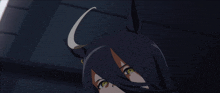 a close up of a person 's face with a horn on their head