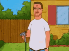 a cartoon man is holding a hose in his hand in front of a yellow house .