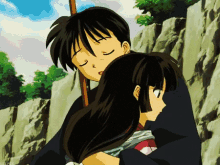 a boy and a girl are hugging each other and the girl is sleeping