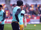 a soccer player with the number 20 on his jersey