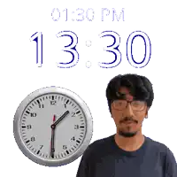 a man with glasses stands in front of a clock that reads 1:30 pm